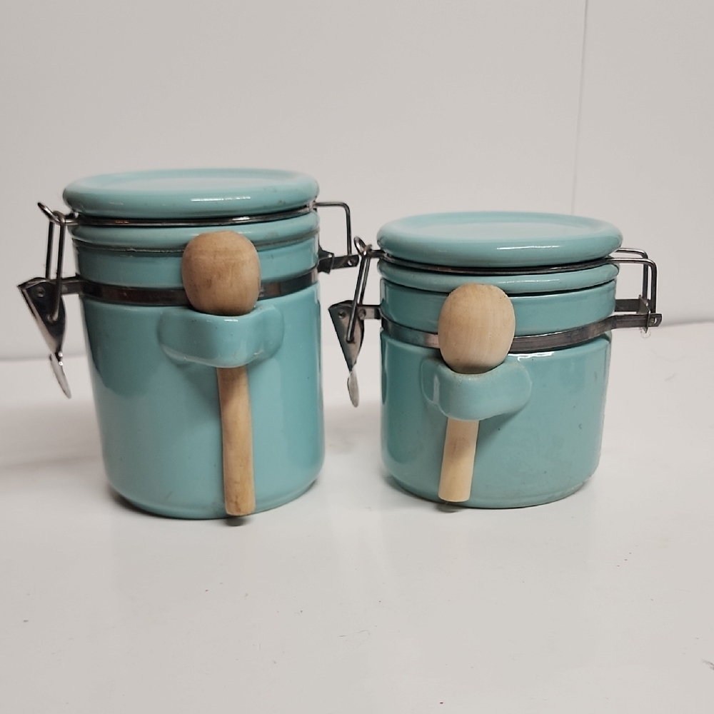 Vintage Kitchen airtight aqua canister set with wooden spoons.